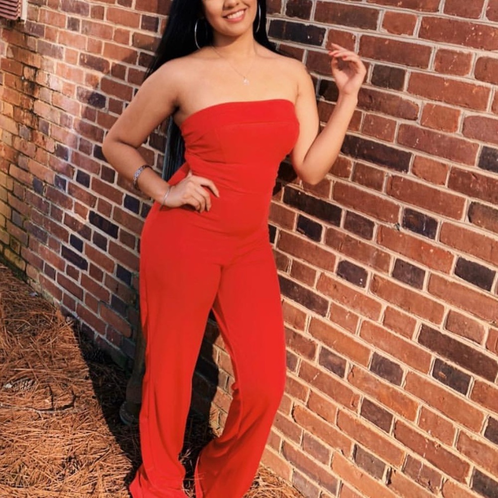 red strapless jumpsuit from pretty little thing